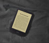 A Kobo Clara BW eReader set on a dimly lit bed, with the screen showing ComfortLight PRO's soft orange candlelight.